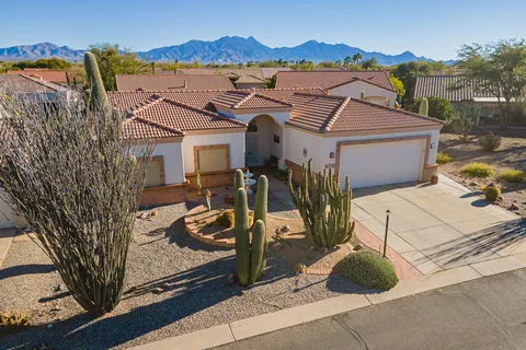 Quail Creek: Tom’s past listing with desert landscaping and mountains beyond